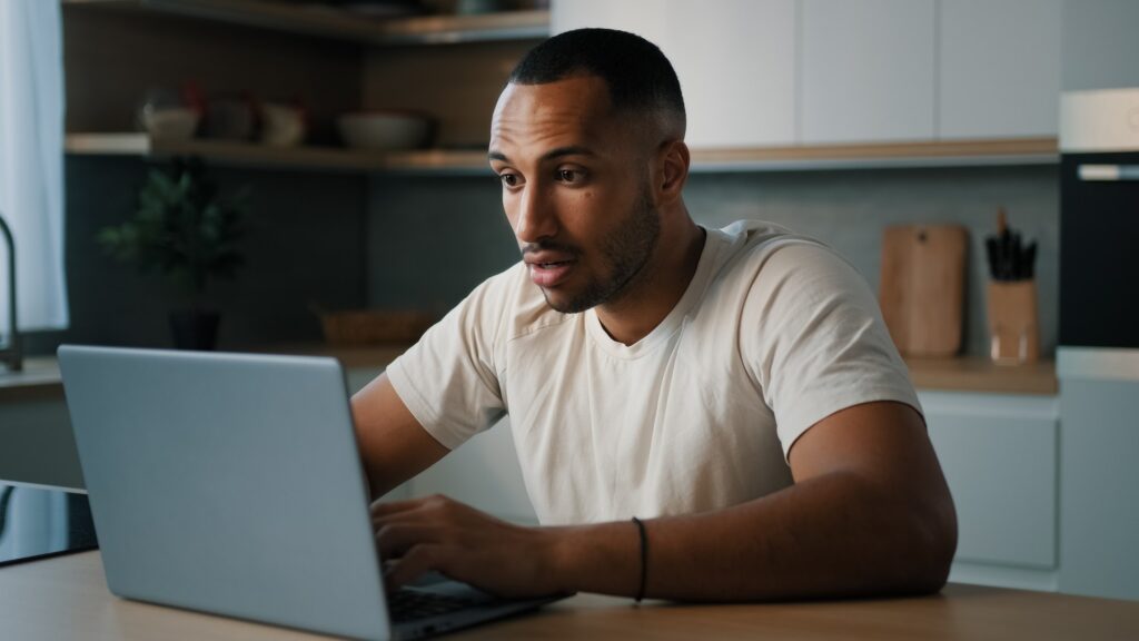 African sad upset worried man American dissatisfied guy male worry about online problem slow